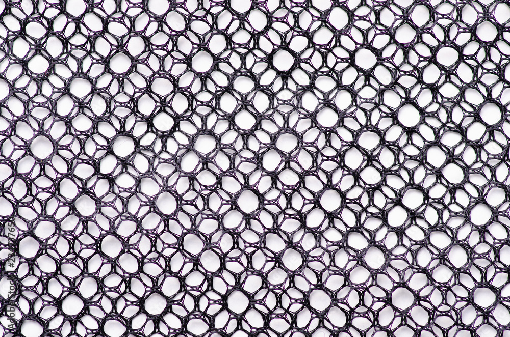 Wall mural black tracery mesh texture fabric macro on a white background