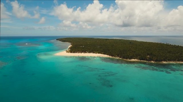 aerial footage tropical island with beach and palm trees lagoon with turquoise water Sea tropical landscape Daco island, Philippines, Siargao. Travel concept Aerial video