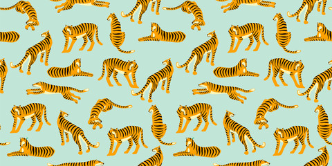 Seamless exotic pattern with tigers. Vector design. © Nadia Grapes