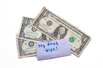 Banknotes of 1 american dollar isolated on white background. Experience in waiter work. Tips in restaurant. Copy space for text