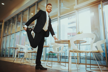 Happy Office Worker Warming Up at Workplace.