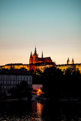 Fototapeta na wymiar Prague, Bohemia, Czech Republic. Historic center included in the UNESCO World Heritage. The Metropolitan Cathedral of Saints Vitus in to the largest ancient castle. Evening.