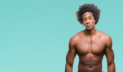 Fototapeta premium Afro american shirtless man showing nude body over isolated background depressed and worry for distress, crying angry and afraid. Sad expression.