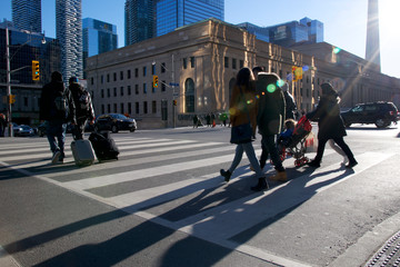 pedestrian crossing the road at the downtown district