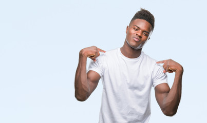 Young african american man over isolated background looking confident with smile on face, pointing oneself with fingers proud and happy.