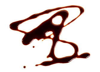 Liquid chocolate isolated on white background. Abstract pattern made of chocolate.