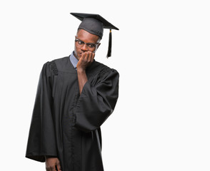 Young graduated african american man over isolated background looking stressed and nervous with...