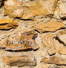 Fragment of the medieval castle wall - closeup.
