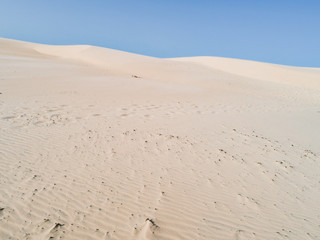 Fototapeta na wymiar Amazing white dune, sand texture , blue sky pastel color, Brazil, Parnaíba. 