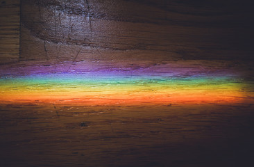 Obraz premium Close up macro photo of rainbow on wooden floor.
