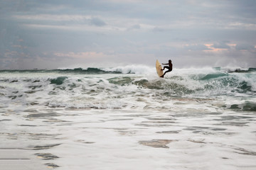 Surfing on a wave in the Indian Ocean