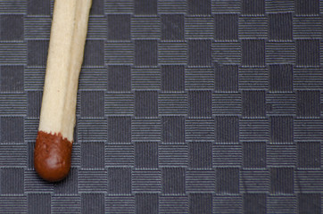 Close-up of matches, Brown, on a black background in a cage.