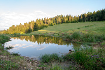 Fototapeta premium landscape with lake and blue sky