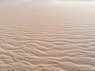 Beautiful structures of sandy dunes. sand with wave from wind in desert - Close up