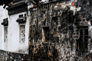Ancient building and stone wall with traditional windows Pinjiang historic quarters in old town in Suzhou, China PDR, Asia