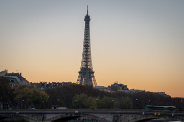 Paris, France - 11 18 2018: panoramic view of Paris and the Eiffel Tower from the Alexander III bridge at sunset