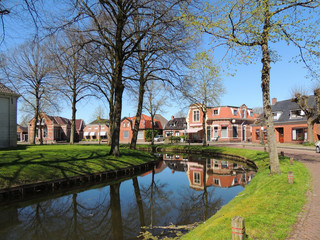Fototapeta na wymiar Central street in town Spijk, Dutch province Groningen, Netherlands