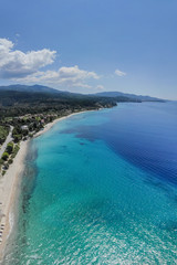 Drone aerial view of sea shore, sandy beach and blue water