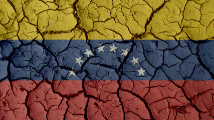 Political Crisis Or Environmental Concept: Mud Cracks With Venezuela Flag