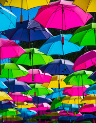 Fototapeta na wymiar colorful umbrellas as a roof