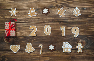 New Year's cookies with figures 2019 year on a wooden background