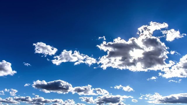 beautiful sunbeams,blue sky, sunrays from behing the clouds