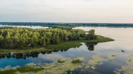 Obraz premium River boat and forest
