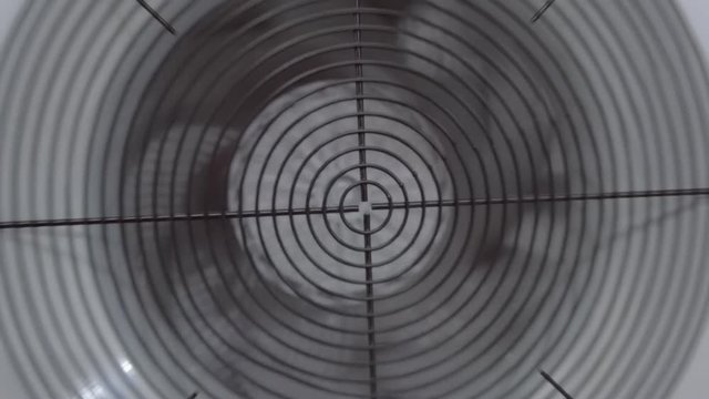 External block of the conditioner of white color with rotating fan
