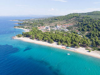 Drone aerial view of sea shore, sandy beach and blue water