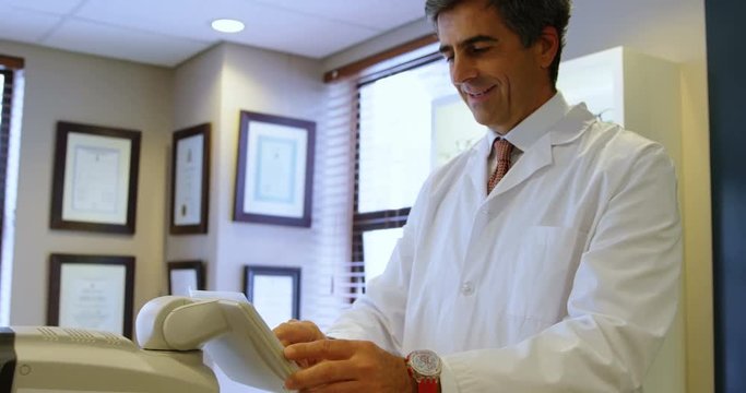 Optometrist examining patient eyes with autorefractors 4k