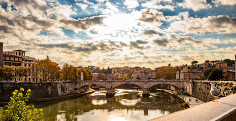 Fototapeta premium view of the Vittorio Emanuele II Bridge at sunset, with the Tiber, in Rome, Italy