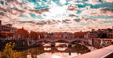 view of the Vittorio Emanuele II Bridge at sunset, with the Tiber, in Rome, Italy