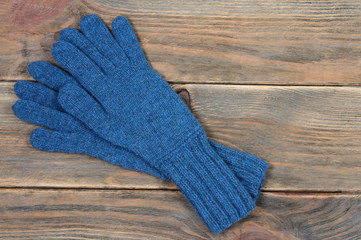 Fototapeta na wymiar Blue handmade gloves. View from above.
