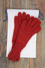 Red gloves and pouch. View from above.