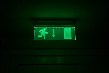 Emergency fire green glass exit door night sign