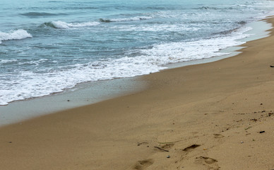 Deserted wild beach without people. Beautiful wild beach with clear turquoise water.