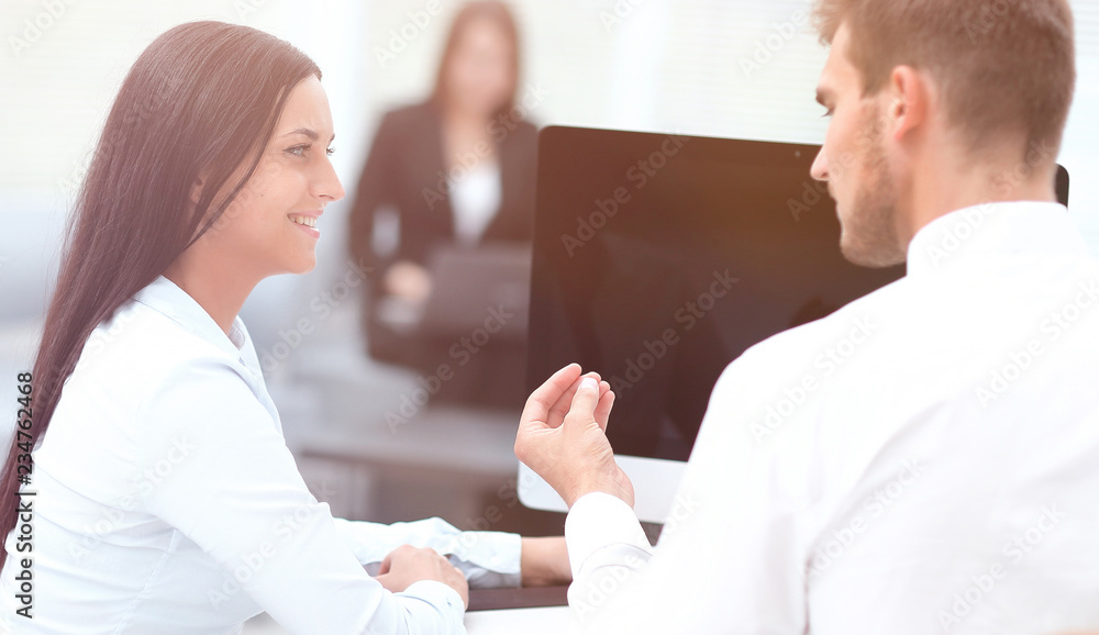 Canvas Prints two successful employee talking sitting behind a Desk