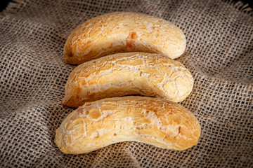 Brazilian homemade cheese bread, AKA 'chipa' isolated a rustic background.