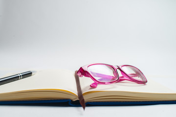 Notebook with glasses and pen, Book with glasses, Blue notebook with glasses, Book with cup of tea