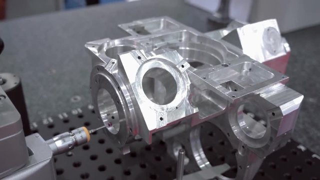 The probe of the coordinate measuring machine (CMM) touch to the detail under researching and introduces data to the computer. Shot in motion