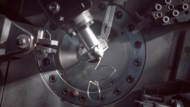 Automatic equipment bending elastic metal wire according to the program, for example springs

