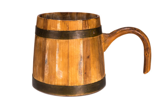 Old traditional wooden mug isolated on white background