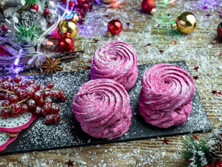 Red currant marshmallow, handmade. A cup of coffee with dessert on the table. New Year...