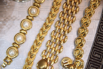 Vintage thick chains of various weaving in gold color