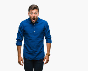 Fototapeta premium Young handsome man over isolated background afraid and shocked with surprise expression, fear and excited face.
