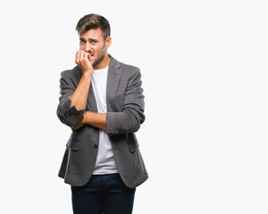 Young handsome business man over isolated background looking stressed and nervous with hands on mouth biting nails. Anxiety problem.