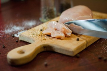Raw Chicken Meat. Fillet of poultry. Wooden plank
