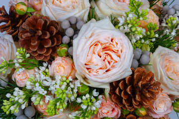 Elite bouquet of beautiful luxury flowers in the Christmas style, close-up on a white background