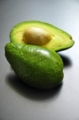 The green avocado on a dark background