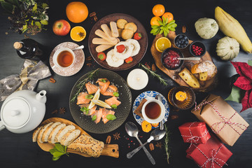 sharing christmas food table diet organic hands celebration homemade drinks tea candle dinning eating friends